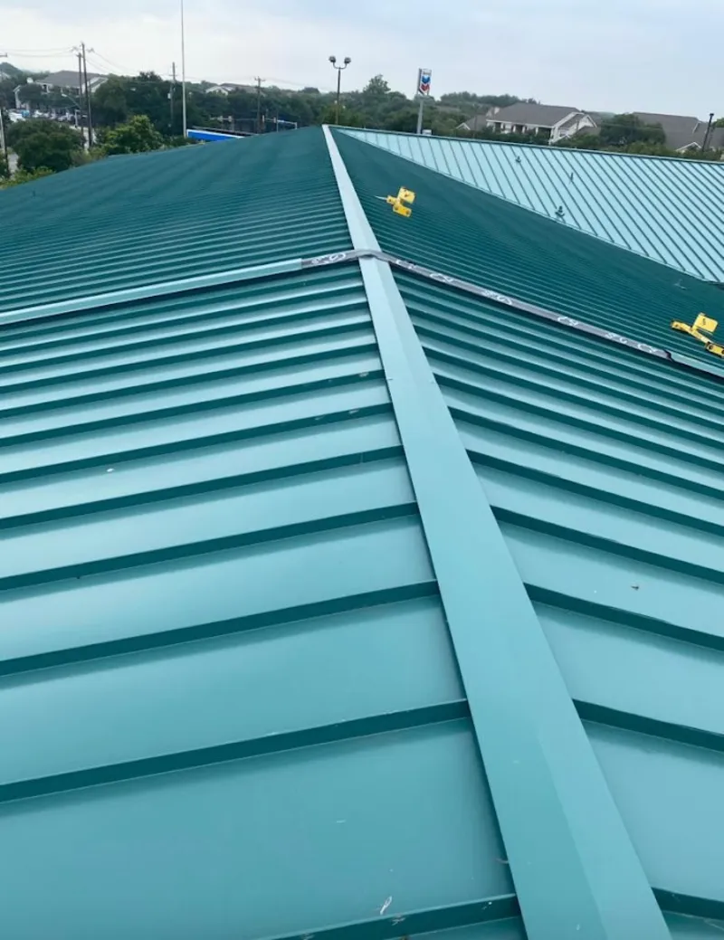 Green commercial metal roof ridge and valley for Metal Roof Repair in Palestine